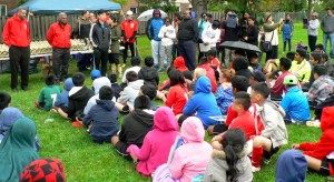 Soccer players with Rosewood Soccer 2015 prepare to receive their trophies from Rosewood Taxpayers Association’s president, Courtney Fisher (standing far left in red), MPP Bas Balkissoon (standing center left in red) and Rosewood Soccer’s coordinator, Jackie (standing far right in black). The players enjoyed a great season and, by witnessing their own Justin Lin receive the Rosewood Taxpayers Association Leadership Award, were inspired to demonstrate leadership in several areas in their lives.